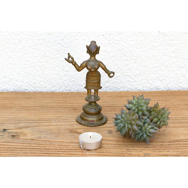 An exquisite pocket-sized masterpiece showcasing precise cross-hatched carvings, an elegant dynamic stance, and a...