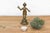 An exquisite pocket-sized masterpiece showcasing precise cross-hatched carvings, an elegant dynamic stance, and a...