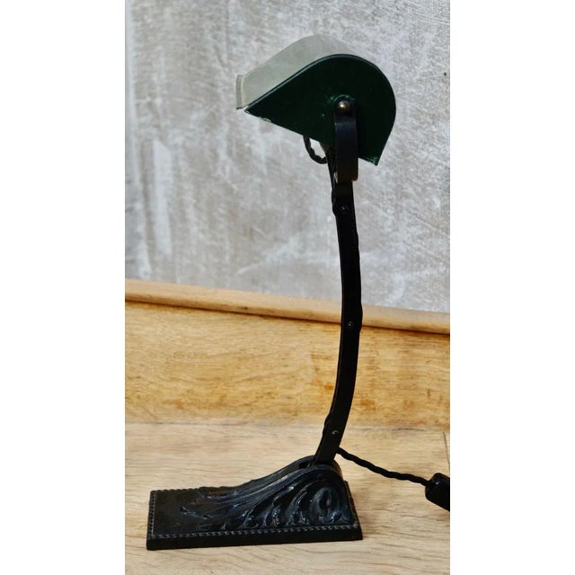 A superb french art deco classic banker's desk lamp, with its arched arm and green tilting enamel shade and directional...