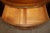 An exceptionally decorative American-made walnut commode in the Adam style, distinguished by its elegant bowed form and an...