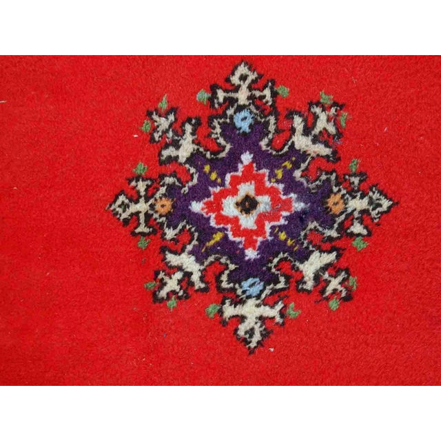 Handmade vintage rug from Berber in Morocco in flashy red wool. The rug is from the end of 20th century in original good...