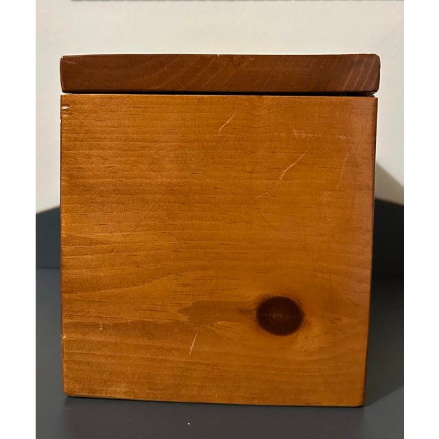 Handcrafted pine box with hinged lid and lined with a burgundy colored velvet material inside. Measures 10” wide x 6” wide...