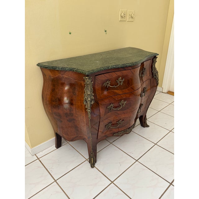 This is a beautiful bombe commode, in the French Louis XV style with beautiful details.&nbsp; The&nbsp; marquetry...