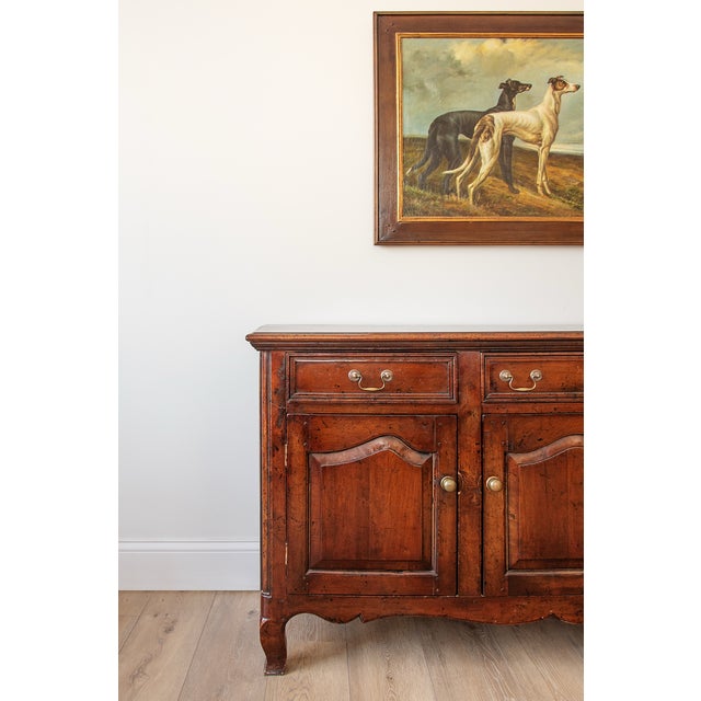 This authentic antique sideboard dates to the late 18th to early 19th century and is crafted in solid hardwood with...