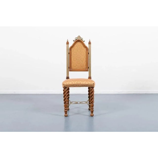 Unique Middle Eastern chair from 1960’s. It features crafted wood legs with gilded steel connections, seat and backrest...