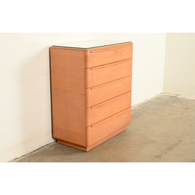 An exceptional Mid-Century Modern five-drawer solid birch highboy dresser or chest of drawers By Heywood Wakefield,...