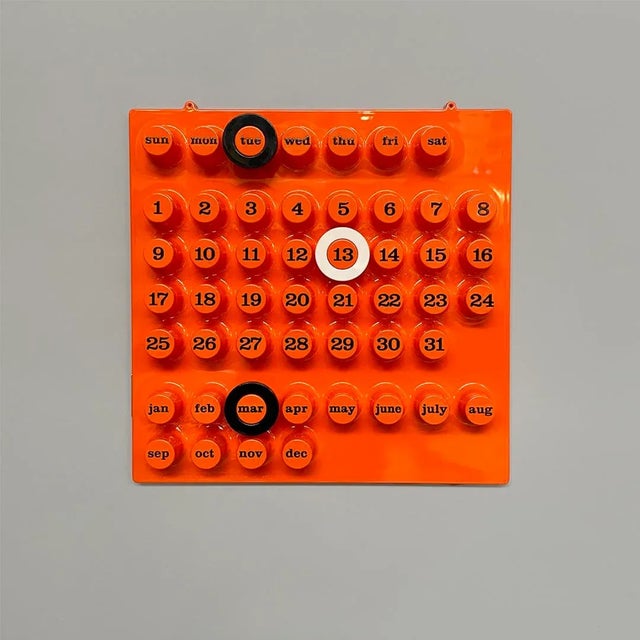 Italian vintage wall perpetual calendar by Della Beffa for Ring a Date, 2000s Wall perpetual calendar in orange plastic....