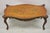 Vintage French Louis XV Style Walnut Coffee Table with Hand Painted Floral Top. Item features pierce carved fretwork...