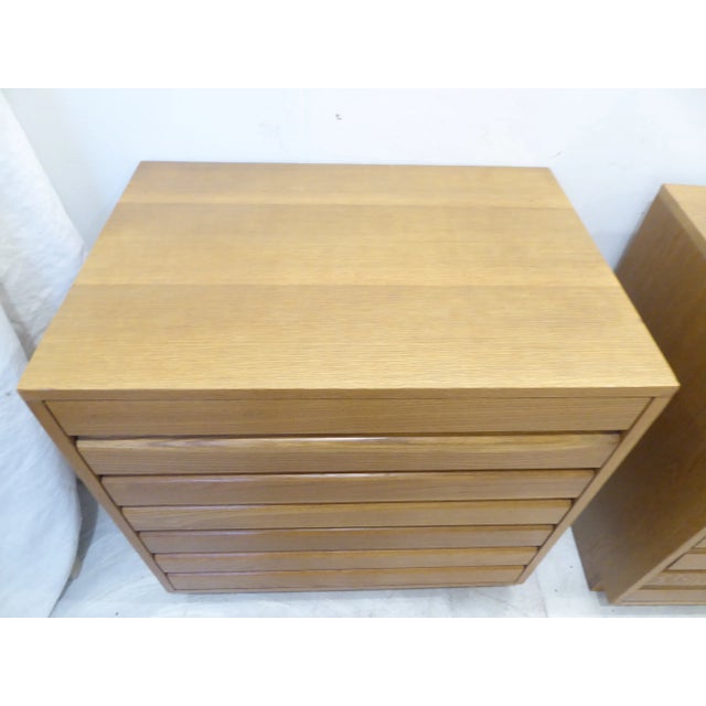 Pair of oak bedside four drawer chests made by Sligh in Grand Rapids, 30"H x 30"W x 21"D.