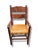 Rustic Mexican-style armchair crafted from rich stained wood with beautifully curved lines and timeless hacienda charm....
