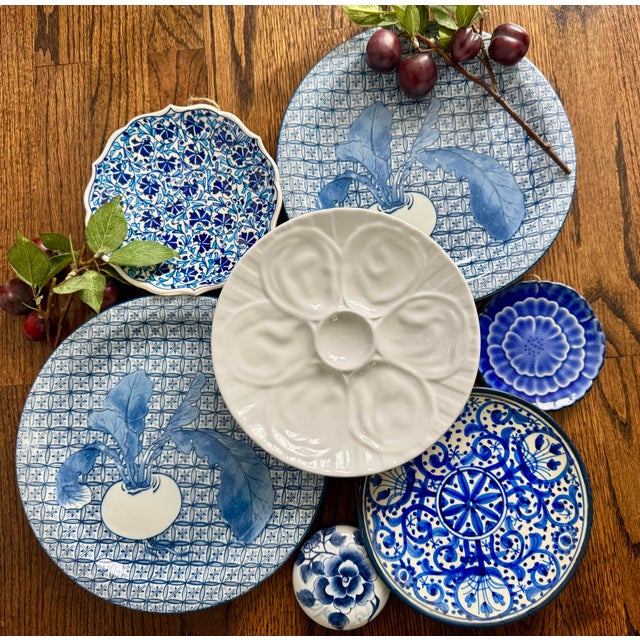 This elegant pair of vintage 1940s Nabeshima porcelain plates features the highly collectible “Garlic Pattern” — an...