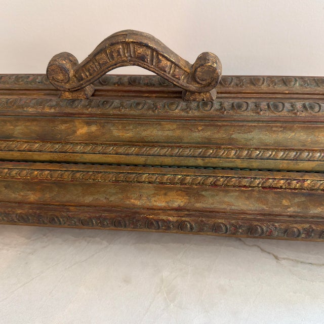 This ornate rococo style footed wooden rectangular box with blackish green velvet interior would be perfect as a...