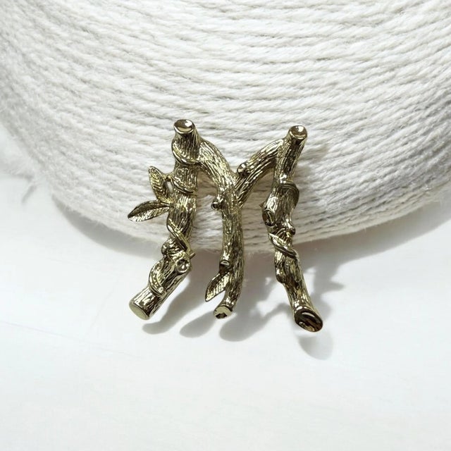 1964 Sarah Coventry from Sarah Coventry’s ABCs Collection. Stylized bamboo motif in the vintage gold-tone brooch with a...