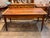 A 19th century fruitwood farm table, the plank top raised on square tapering legs joined by pegged mortise and tenon...