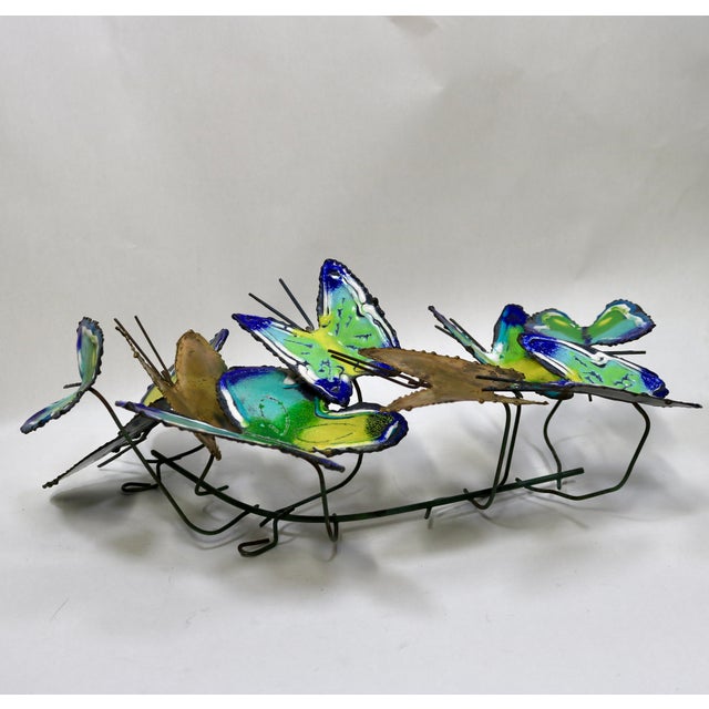 Elevate your space with this rare, authenticated piece of mid-century design. This striking butterfly swarm wall sculpture...