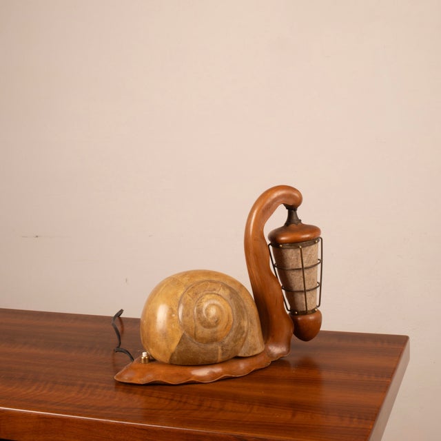 An exceptional and extremely rare lighting object designed by Aldo Tura in the 1950s, this sculpted snail-shaped table...