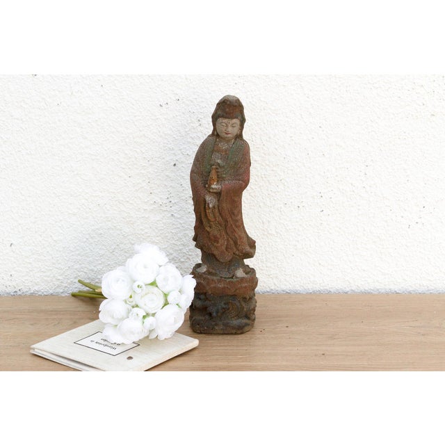 Discover the serene beauty of a peaceful, contemplative moment captured in wood with this charming petite carved and...