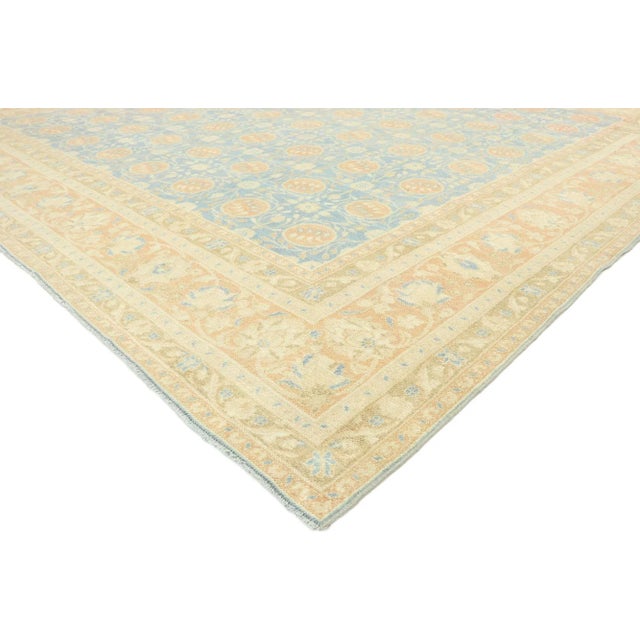 distressed vintage Portuguese Khotan style rug with Italian Mediterranean style. Melding sumptuous elegance and weathered...