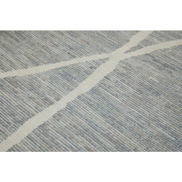 Introducing our exquisite handwoven wool modern Moroccan-style rug, a stunning blend of traditional craftsmanship and...