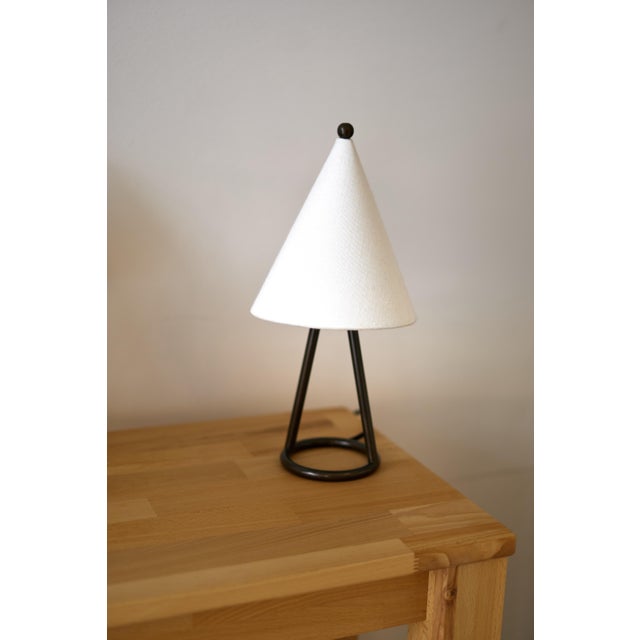 Andorra, Contemporary style Table Lamp, Iron, Black oxidised and lacquered brass, Linen, D115xH300mm, 1xG9 This piece has...