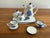 1970s miniature porcelain tea set. The blue and white tea service features hand painted flowers and includes a tea pot...