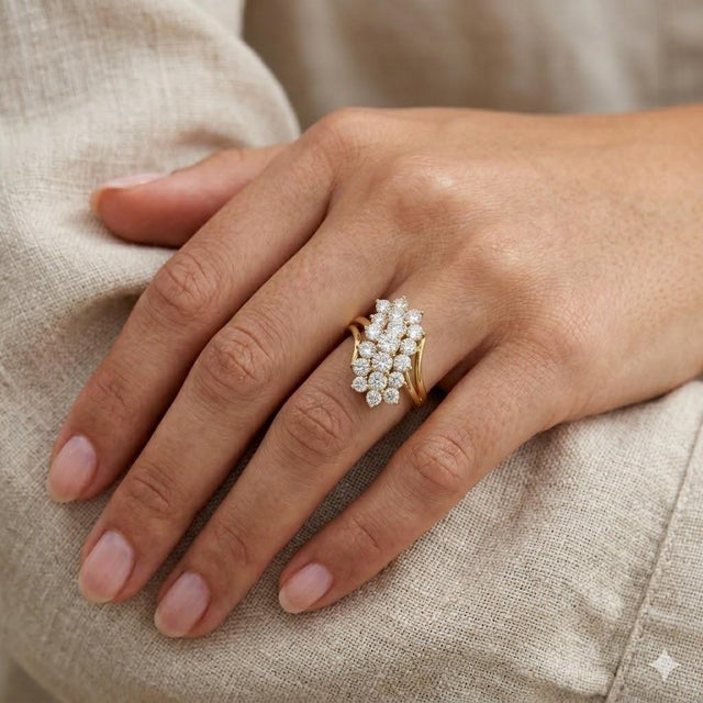 14k Yellow Gold cluster ring with approximately 2.50 carats of round white diamonds 5.76 grams size 4.75, (sizable)