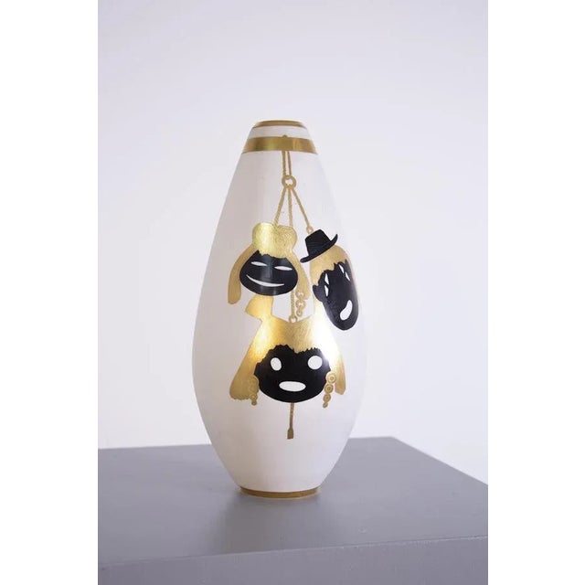 Precious Italian vase from the 1950s made by the great silversmith Arrigio Finzi. The vase has an elliptical shape made in...