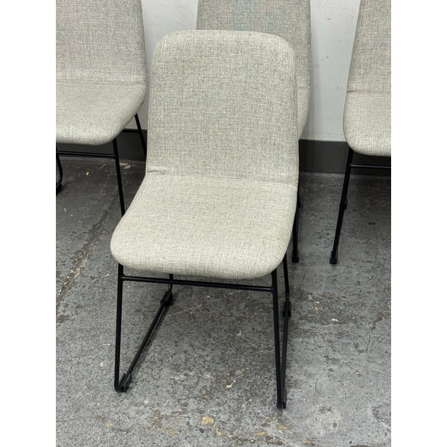 Design Plus Gallery presents a Set of Four Zoe Dining Chairs from Pottery Barn. These upholstered dining chairs pair a...