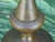 This Tabe Lamp is a vintage piece from the 1930s, featuring a geometric Art Deco design made of antique brass. Standing at...