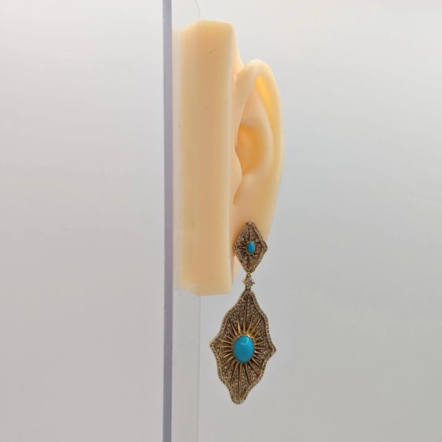Gorgeous earrings with big turquoise oval cabochons and good quality white diamond rounds. Handmade in 18k yellow gold....