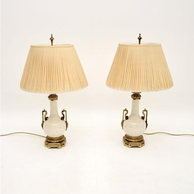 A stunning pair of antique French ceramic and gilt metal table lamps. They were made in France, they date from around the...