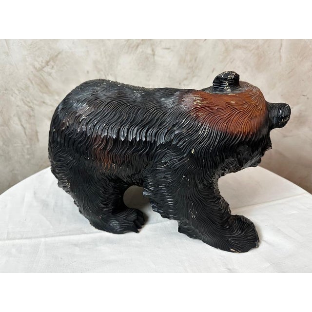 Solid wood bear sculpture, crafted according to the tradition of the Ainu, the indigenous people of Hokkaido Island in...