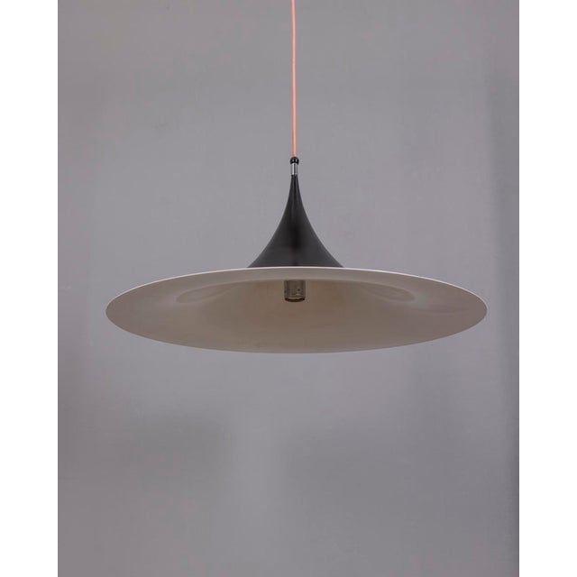 Danish chandelier in black metal, design Claus Bonderup & Torsten Thorup for Fog & Mørup, 1970s. I have official proof of...
