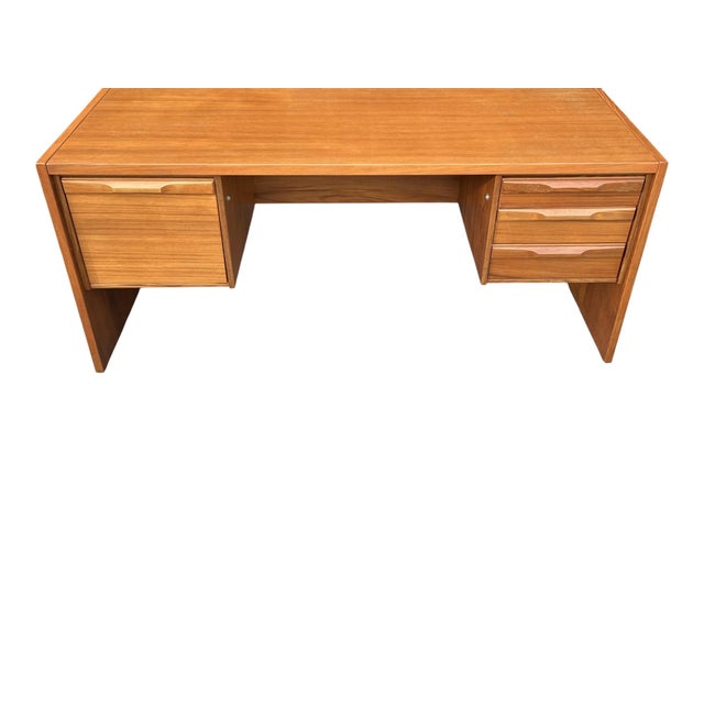 This exceptional 1960s Danish executive desk exemplifies the timeless sophistication of Scandinavian Modern design....