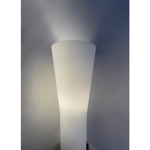 Brass wall light and matt opaline glass cone. Only one wall light available. Period: 1970 Origin: Italy Dimensions:...