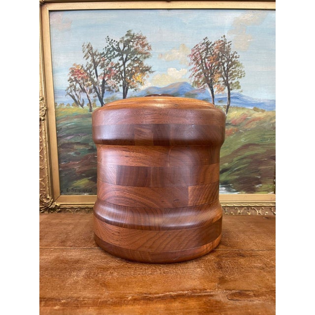 Circa 1960s. Solid Walnut lid and casing, as stated on the markers mark on the bottom. Contrasting wood grains cover the...