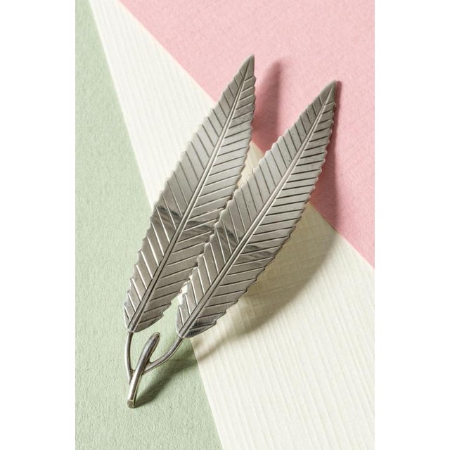 Beautiful silver brooch in the form of naturalistic silver leaves on a twig by Gertrud Engel. Lovely attention to detail....