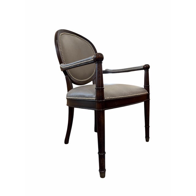 Sophisticated elegance meets comfortable, modern utility in this striking pair of Louis XVI style open-arm fauteuils...