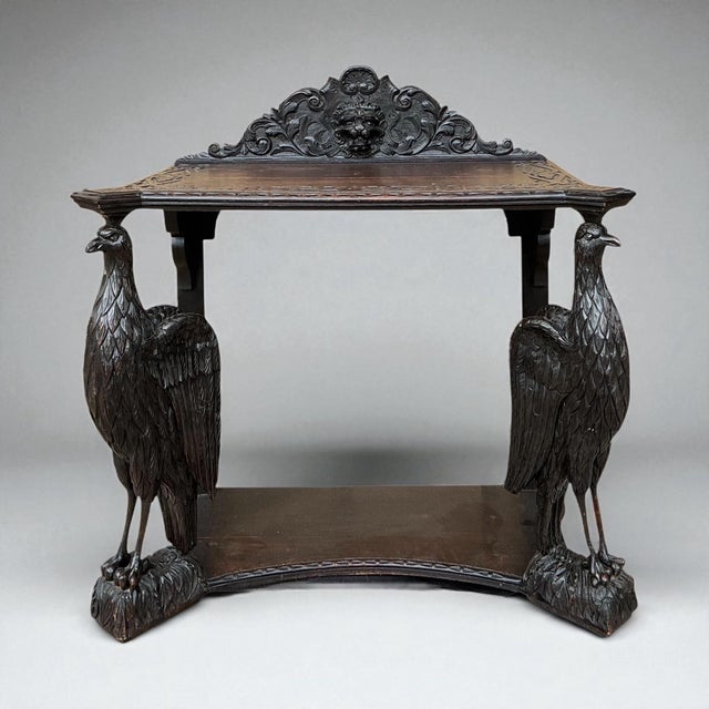 This is a unique English Victorian carved oak eagle form console table or credenza. The back has a carved lion cartouche....