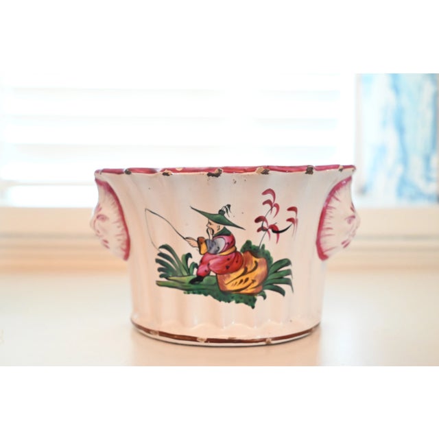 This pair of charming bough pots or bouquetières was made to organize flowers. They are French faience from the eastern...