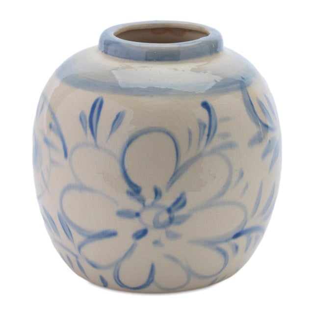 Add a touch of timeless charm to your space with this Blue Floral Stoneware Decorative Container. Showcasing a floral...