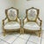 The details on this small throne style chair are gorgeous. White chair with gold leaf details and a flower design. In love...
