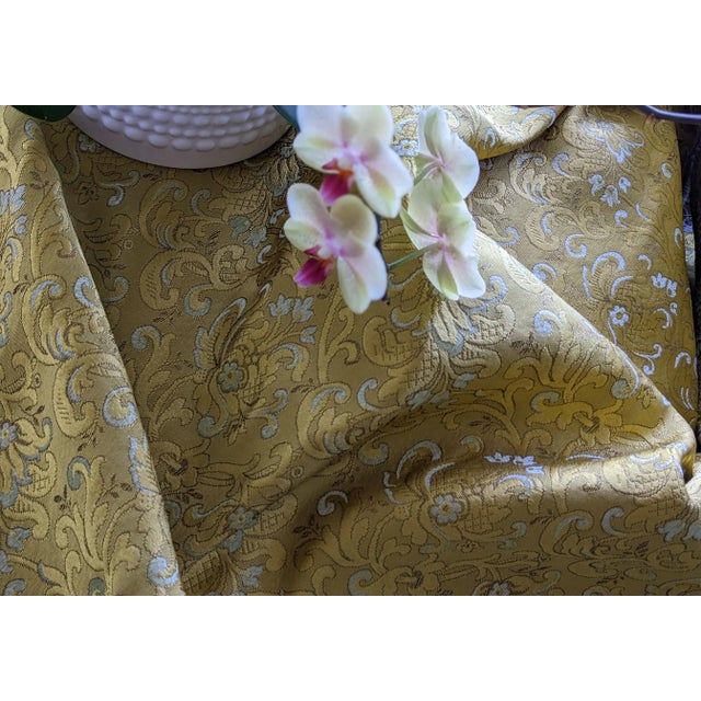 Beautiful gold and light green (raised), strong but soft fabric. Great for luxurious upholstery, grant drapes, bed cover...