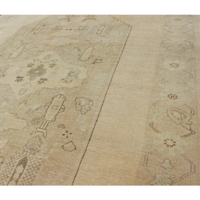 Tribal Faded Turkish Oushak Rug With Cream and Brown Central Medallion 5'6 X 8'6 For Sale - Image 3 of 10