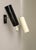 A pair of minimalist wall lights from the 60s of bünte & remmler in the noble combination of light beige and black. the...