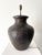 A large handmade table lamp in terracotta with a rich brown glaze, dating from the late 20th century. The impressed...