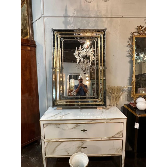 Fabulous modern 2 tone Murano glass mirrors. Beautiful silver colored and gold colored textured glass with flowers on the...