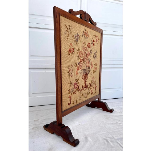 Here is a beautiful fireplace screen from the late 1800's-early 1900's that features a solid wood base that frames a...