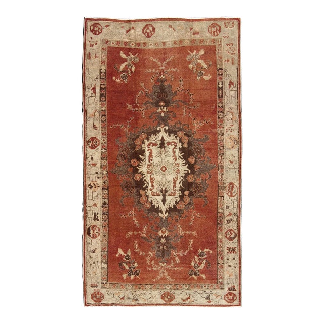 Antique Turkish Oushak Rug With Terracotta Field, Cream, and Soft Brown Accents For Sale