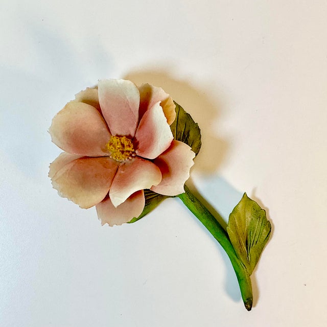 What a lovey table top decor touch. This Vintage Capodimonte porcelain peach floral bloom on a sage green stem with leaves...